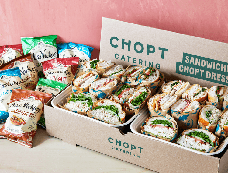 Catered sandwiches and bags of chips