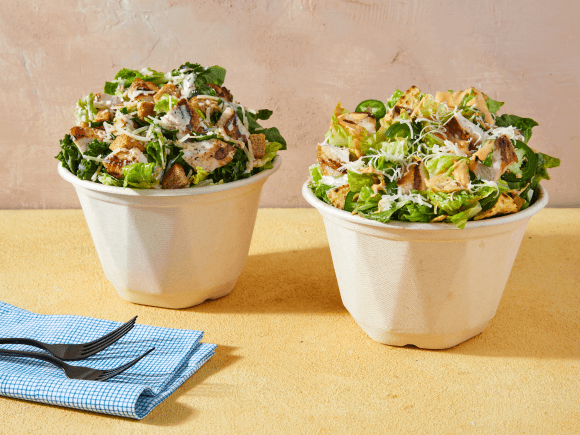 Two fresh Chopt salads on a table